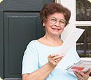 A woman looking through her mail.