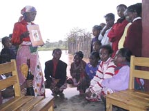 Photo of a woman presenting to an audience on environmental health.