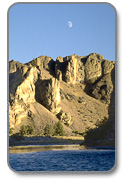 Silhouetted rocks and sun lit rocks above the John Day River.