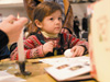 A girl participates in an Easter egg-painting workshop