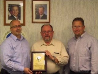 John Rohlf (DA), Ken Erlenbusch (Realty Officer), and Todd Jorgensen (ADA)