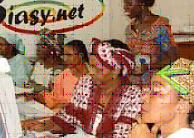 Women entrepreneurs gather in
cybercafés to learn basic computer and Internet skills.