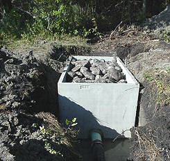 Photo of a concrete fish barrier - Photo credit:  U.S. Fish and Wildlife Service / Steve Maneval