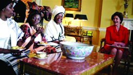 Photo of Mrs. Laura Bush speaking with HIV-positive mothers from South Africa at their visit to the White House.