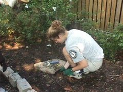 VISTA Volunteer planting a garden