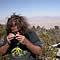 lichenologist using a hand-lens to identify a lichen