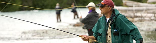 people fishing at a stream