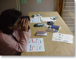 Photo of a person using binoculars / Photo credit: U.S. Fish and Wildlife Service