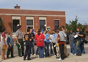 These students explored the history of many buildings in their community, including the post office in the background.