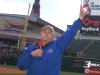 Benson holds a baseball in the air.