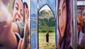 Child framed in doorway of exhibit with mountains in background (Joel Lipovetsky)