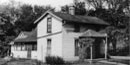 Hoover's birthplace as it appeared before restoration: a two-story white frame house.