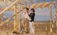 Photo of two people discussing a construction of a new home