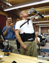 VA Chief Prosthetics and Clinical Logistics Officer Fred Downs puts the advanced artificial arm prototype through its paces