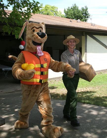 US Army Corps of Engineers Park Ranger with Bobber the Water Safety Dog at Headquarters Organization Day.