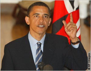 Close-up of Obama with hand raised (AP Images)