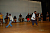 Two team members demonstrate a West African dance for students at Bishop McNamara High School 