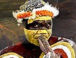 Aboriginal Australian dance member plays didgeridoo.