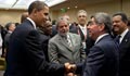 Obama shaking hands with other leaders