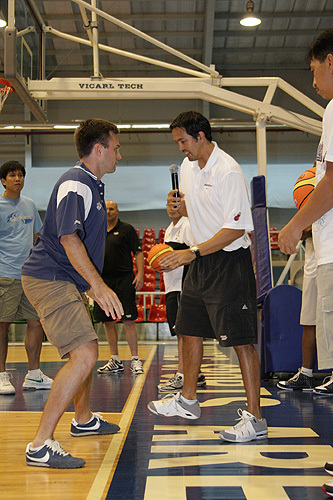 Photo of Coach Erik Spoelstra demonstrating defensive drills to MBA superstar Alex Compton