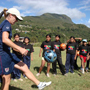 Photo of Cromwell demonstrating a drill at a soccer skills clinic in Los Yungas