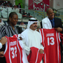 Photo of Sports Envoys receiving jerseys while in Bahrain.