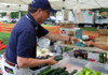 Secretary Fisher purchases produce at Woodstown Farmers Market