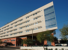 Photo of facility with EIFS used for building envelope. Building is tan in color with a sharp corner of windows.