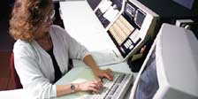 Photograph showing a dispatcher at a terminal..