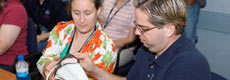 Teachers inspect spacewalking gear