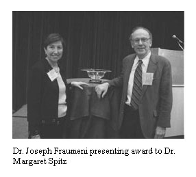 Dr. Joseph Fraumeni presenting award to Dr. Margaret Spitz