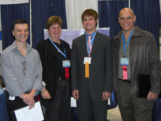 Winner Daniel Jeffrey Martin with NIDA science fair judges at the 2009 Intel International Science and Engineering Fair