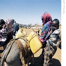 A Kenyan woman loads her donkey with containers of water in Wargadud, Kenya (file photo)