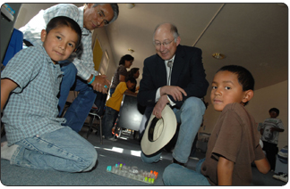 Secretary Salazar accompanied by Navajo Nation President Joe Shirley (left) visits students at the Hunters Point Boarding School, Window Rock, AZ. (Photo credit: Tami A. Heilemann-DOI)