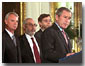 "Standing with me are seven of those who have been selected this year," said President George W. Bush during a ceremony honoring the U. S. Nobel Laureates in the East Room Nov. 27. "Among their achievements are path-breaking discoveries in physics, helpful insights in the workings of the market economies, and a new treatment for Parkinson's Disease."White House photo by Tina Hager.