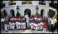 President George W. Bush and Mrs. Laura Bush stand with the All-Star Tee Ball teams and participants on the South Portico Wednesday, July 16, 2008, following a double-header at the White House, pitting Eastern U.S. against Central U.S. and Southern U.S. against Western U.S. White House photo by Eric Draper