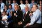 President George W. Bush participates in a conversation on the economy with employees of ISCO Industries in Louisville, Ky., Thursday, Feb. 26, 2004.  White House photo by Tina Hager