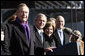 President George W. Bush stands with his father, former President George H. W. Bush and Mrs. Laura Bush during the commissioning ceremony of the USS George H. W. Bush (CVN 77) aircraft carrier Saturday, Jan 10, 2009 in Norfolk, Va. White House photo by Eric Draper