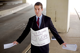 a job candidate passes out resumes to PHiladelphia motorist on July 22 2009