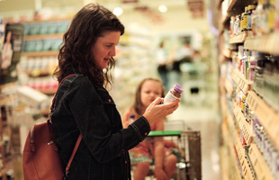 Woman in grocery store shopping