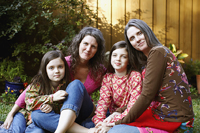 Photograph of two mothers and their daughters