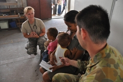 A Mother and her children receive treatment in Dili