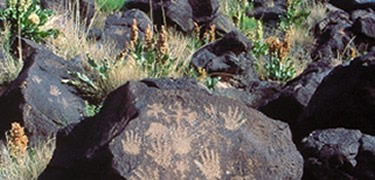 Hand Petroglpyhs on volcanic rock