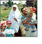 Link to Family Planning (Photo of a father, mother, and their three children smiling.)