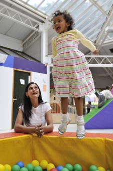 Sam Latif plays with her autistic daughter, Keira O'Grady, at The Smart Centre, east London
