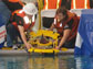 Photo of two Long Beach City College ROV Team members launching the ROV in the pool.