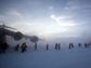 Passengers make their way from an Air Force C-17 air transport at Pegasus Airfield, Antarctica.