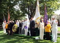 Shinseki is flanked by Ruth Stonesifer (to Shinseki's right), President of Gold Star Mothers.