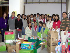 The AVID students pose with their donations along with Region 10 Community Partners Coordinator Brandi Gurrola (far left) and Resource/External Relations Specialist Luis Zamarripa (far right)