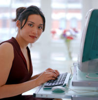 Photo of woman operating computer